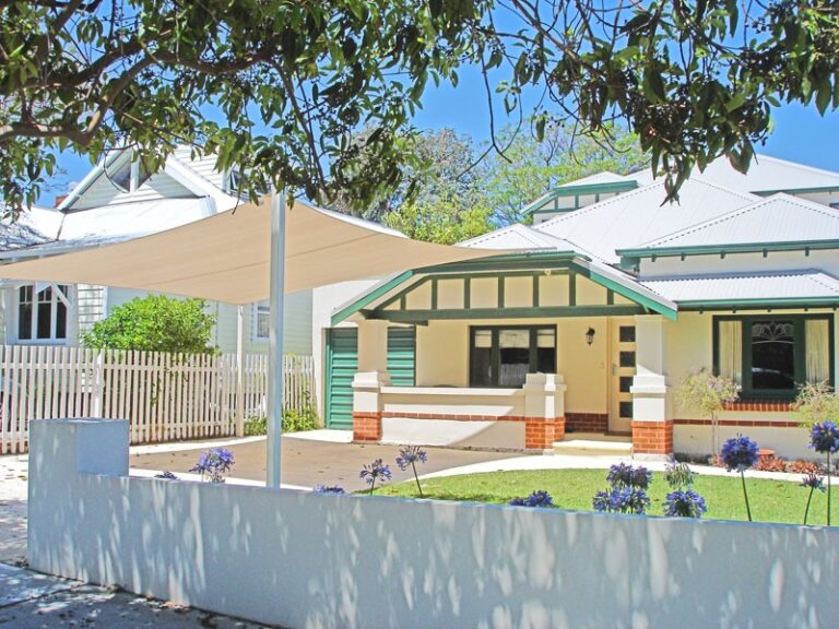 Cream shade sail over the front garden of a Perth home