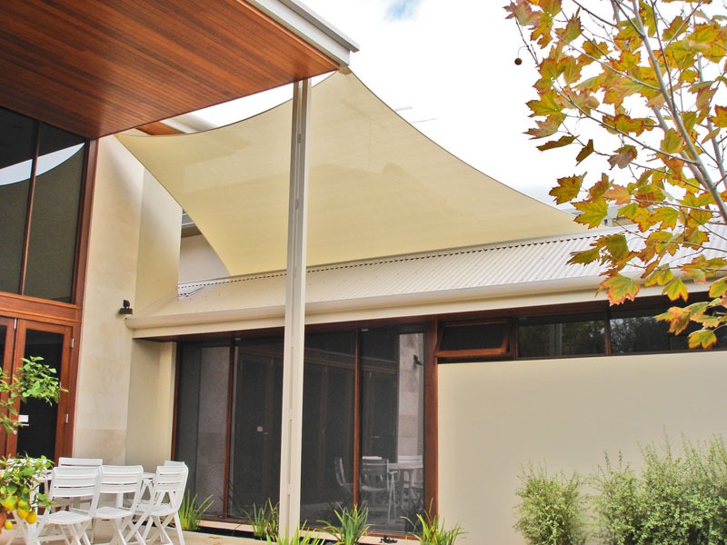 Cream shade sail over an alfresco area