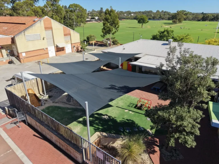 Grey shade sails over an early learning playground in Perth
